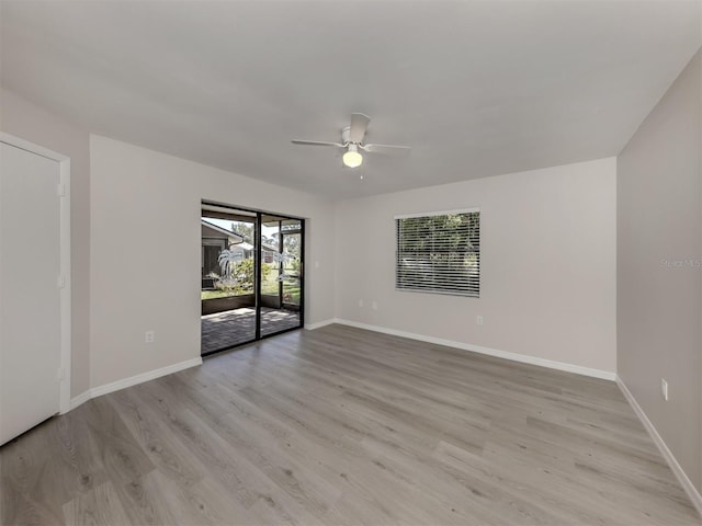 empty room featuring ceiling fan and light hardwood / wood-style flooring