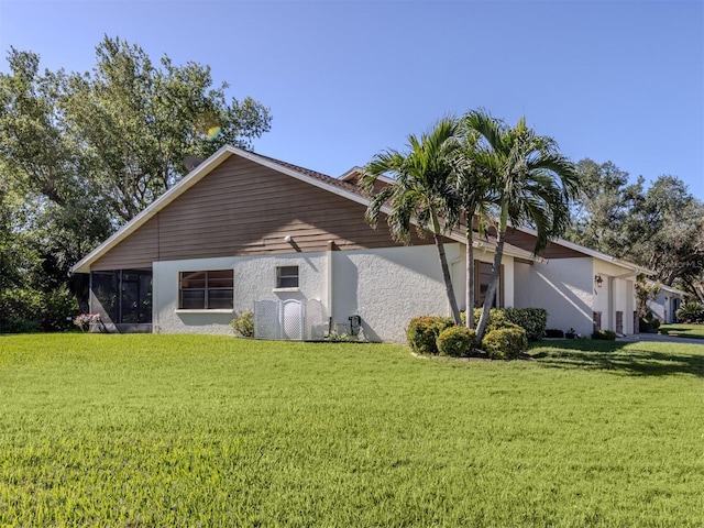 view of home's exterior featuring a lawn