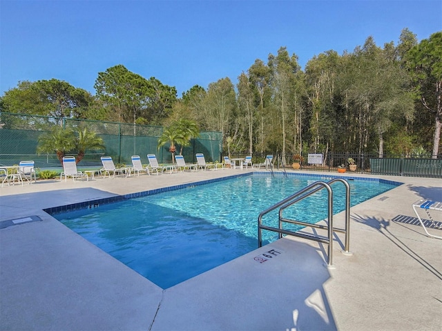 view of swimming pool featuring a patio area