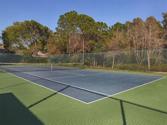 view of sport court with basketball hoop