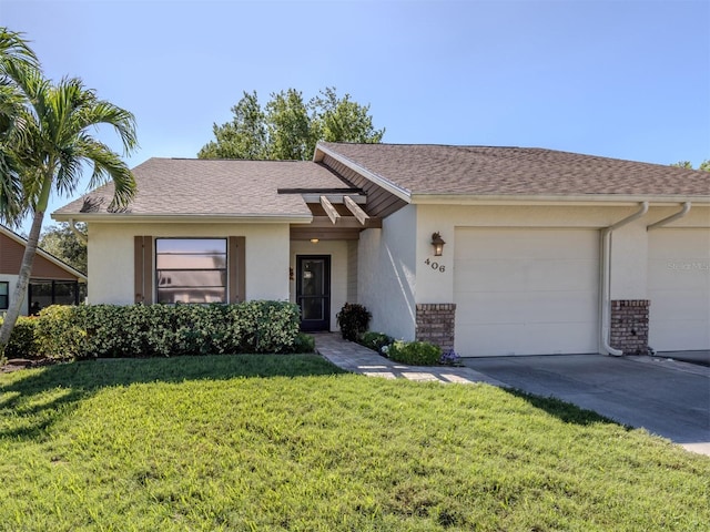 ranch-style home featuring a garage and a front lawn