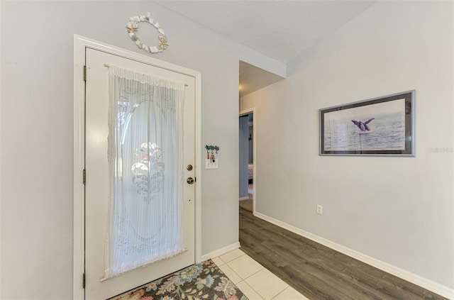 foyer entrance with light wood-type flooring