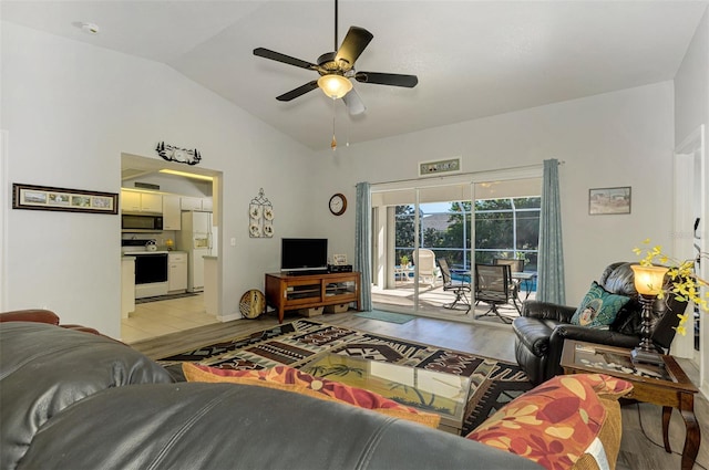 living room featuring light wood-type flooring, ceiling fan, and lofted ceiling