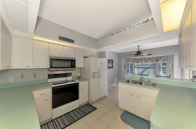 kitchen featuring ceiling fan, sink, kitchen peninsula, white appliances, and light tile patterned floors