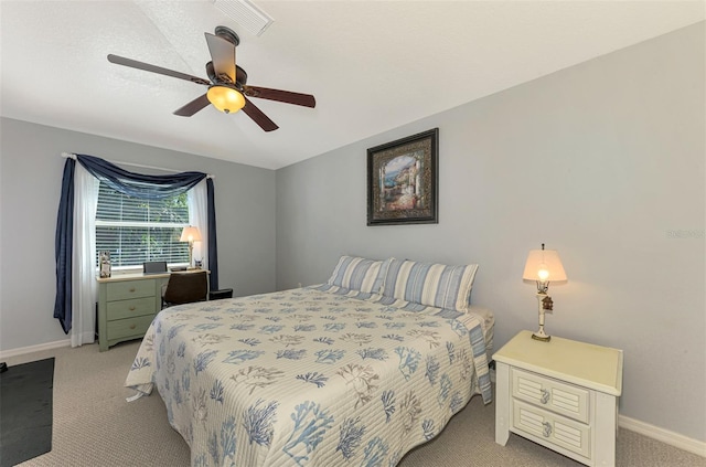 bedroom featuring light carpet and ceiling fan