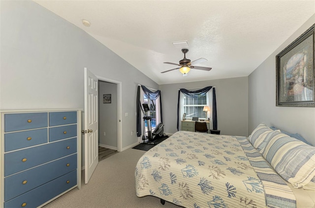 bedroom featuring a textured ceiling, ceiling fan, light carpet, and vaulted ceiling