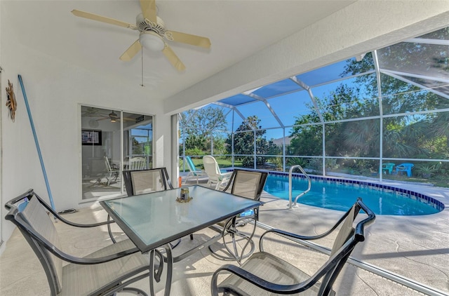 view of pool featuring ceiling fan, a lanai, and a patio