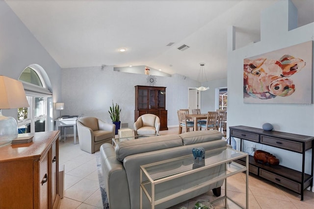 living room featuring light tile patterned floors and lofted ceiling