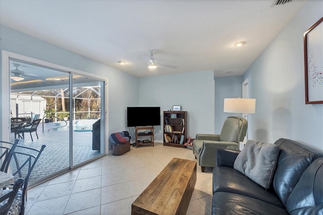 living room with light tile patterned floors and ceiling fan