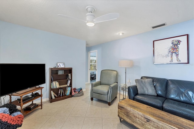 tiled living room featuring ceiling fan