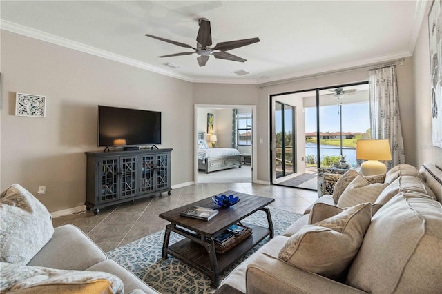 tiled living room with ceiling fan and ornamental molding