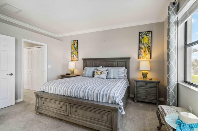 bedroom featuring light colored carpet, a closet, and crown molding