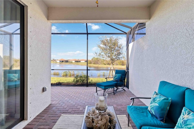 sunroom / solarium with a water view