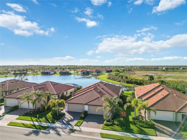 birds eye view of property featuring a water view