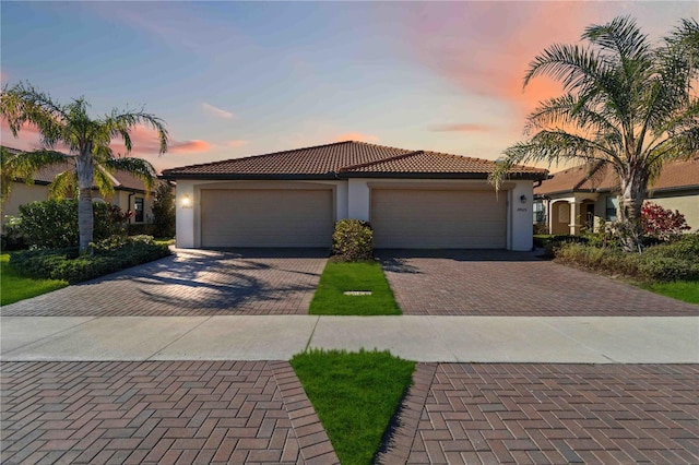 mediterranean / spanish-style home featuring a garage