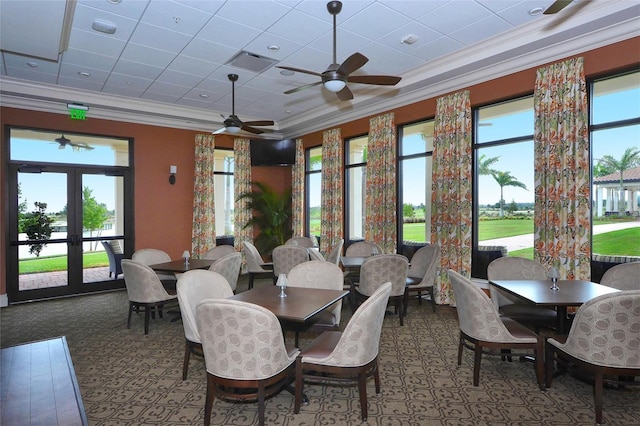 dining space featuring ceiling fan, crown molding, and french doors