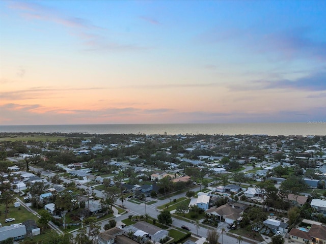 aerial view at dusk with a water view