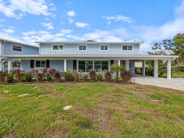 view of property with a carport and a front yard