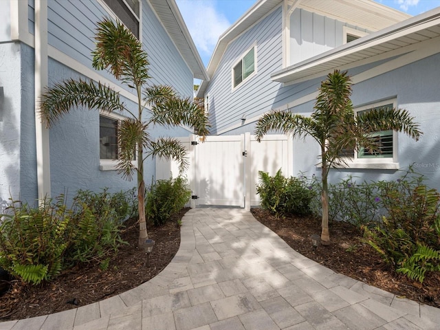 842 Nokomis Ave S, Venice, FL 34285 - view of property exterior featuring a gate and board and batten siding