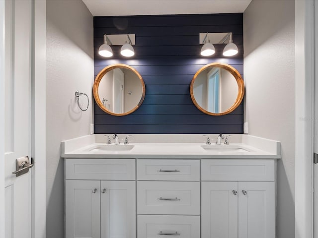 842 Nokomis Ave S, Venice, FL 34285 - full bathroom featuring double vanity and a textured wall