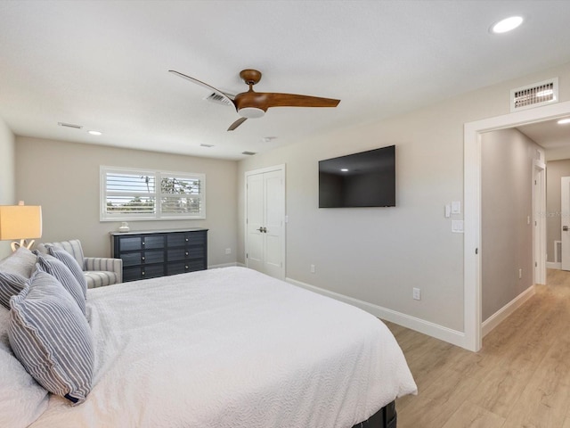 bedroom with ceiling fan and light wood-type flooring