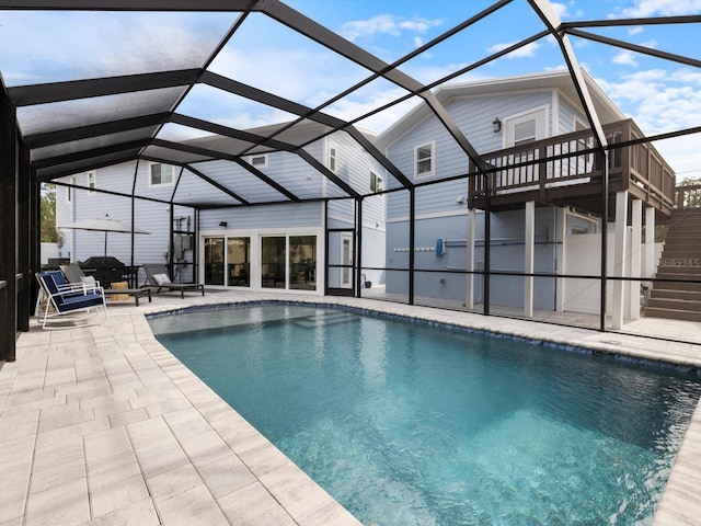 view of pool featuring a patio area and a lanai