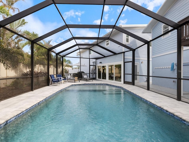 view of pool with a lanai and a patio