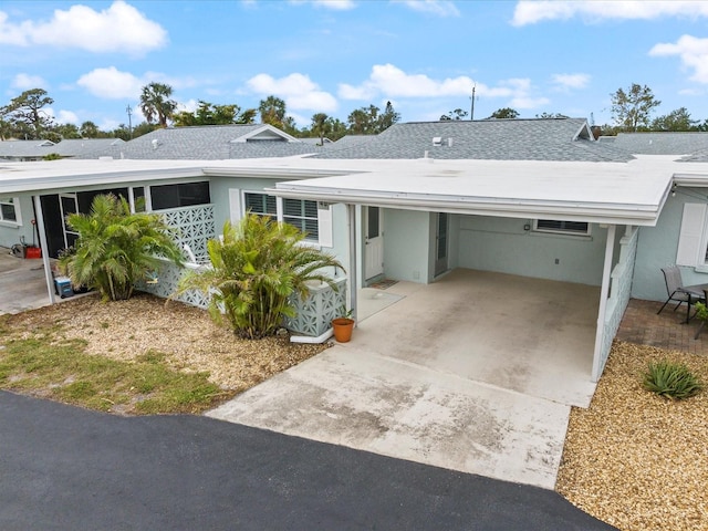 ranch-style house with a carport