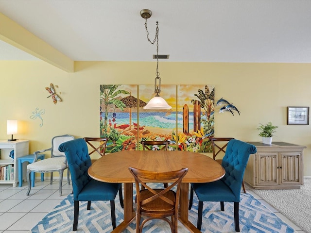 dining space featuring light tile patterned floors