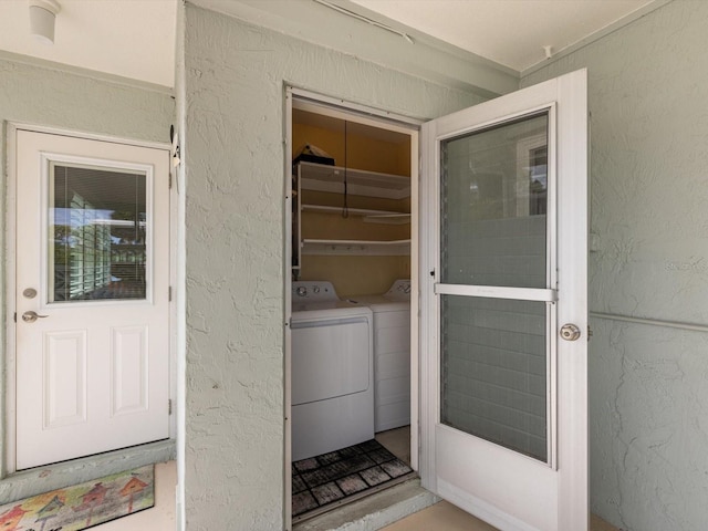 entrance to property with independent washer and dryer