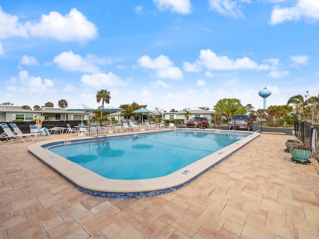 view of swimming pool featuring a patio area