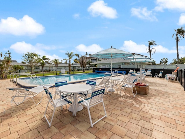 view of swimming pool featuring a patio