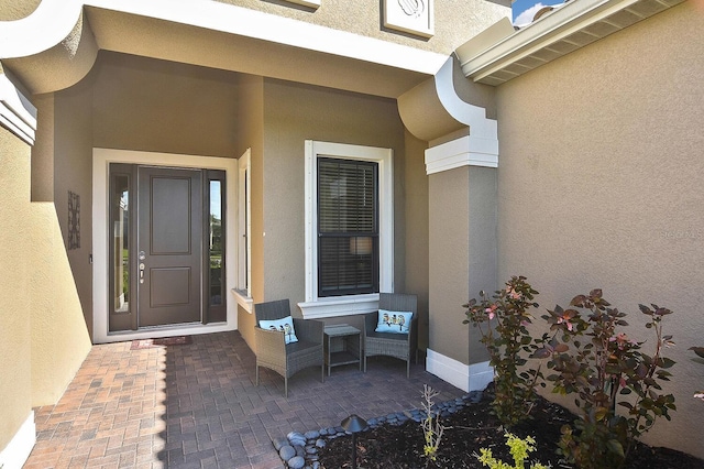 doorway to property with a patio