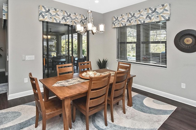 dining space featuring a chandelier and dark hardwood / wood-style flooring