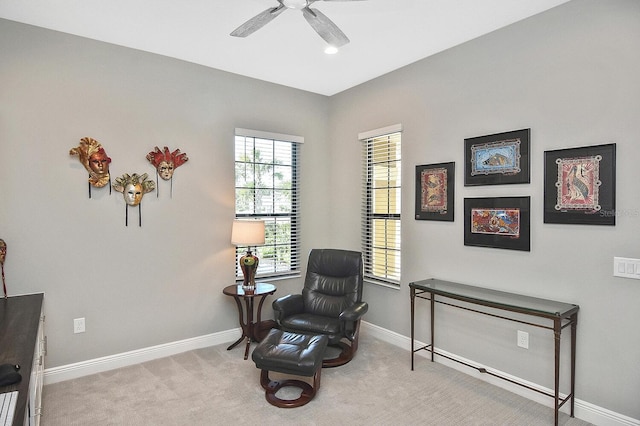 sitting room with light carpet and ceiling fan