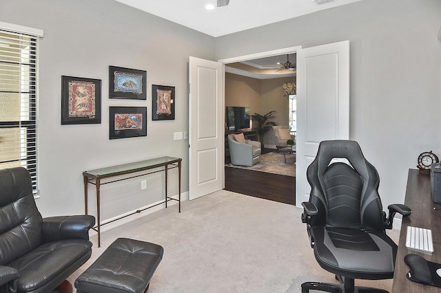 home office with ceiling fan and light colored carpet