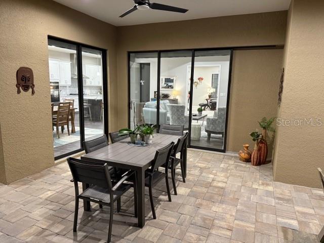 interior space featuring ceiling fan