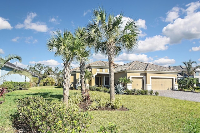 view of front of house with a garage and a front yard