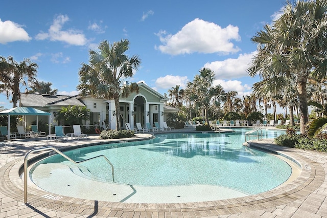 view of swimming pool featuring a patio area