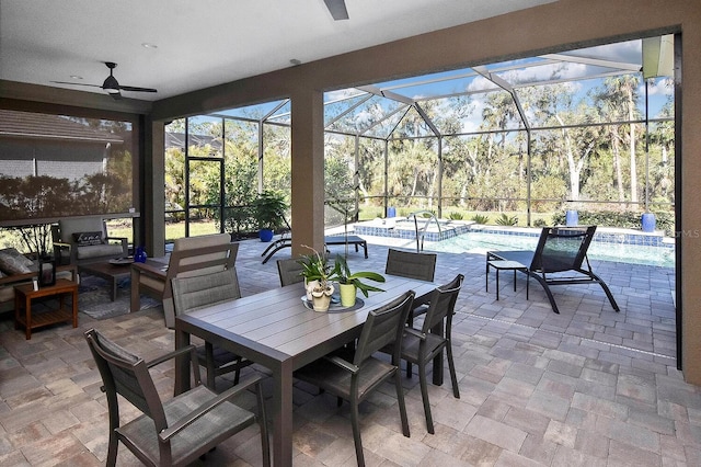 169 N Cayman Isles Blvd, Englewood, FL 34223 - view of patio featuring a ceiling fan, glass enclosure, a pool with connected hot tub, and outdoor dining area