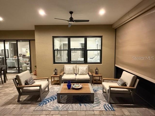 169 N Cayman Isles Blvd, Englewood, FL 34223 - living room featuring a ceiling fan and recessed lighting