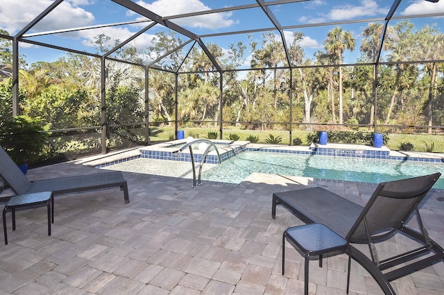 169 N Cayman Isles Blvd, Englewood, FL 34223 - swimming pool with an in-ground hot tub, a patio area, and glass enclosure