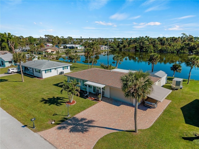 birds eye view of property with a water view