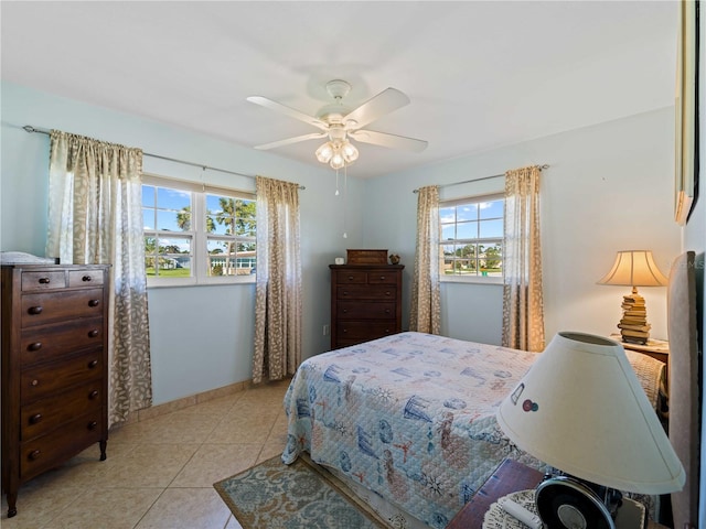 bedroom featuring ceiling fan and light tile patterned floors