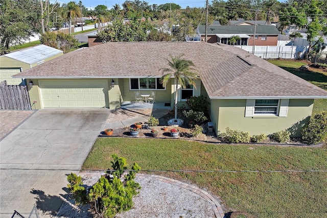 ranch-style home with a garage and a front lawn