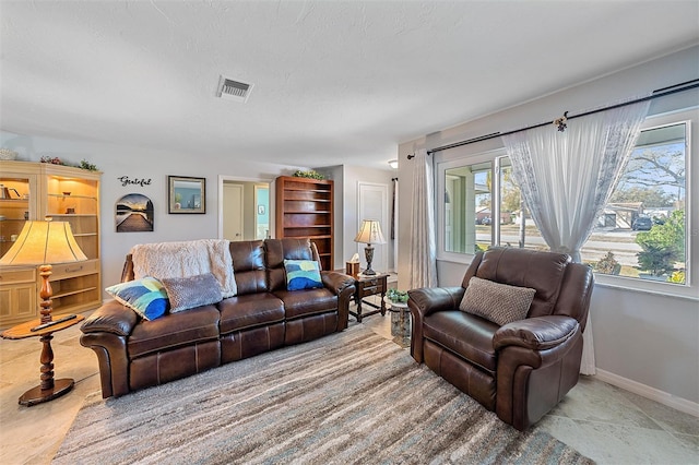 living room featuring a textured ceiling