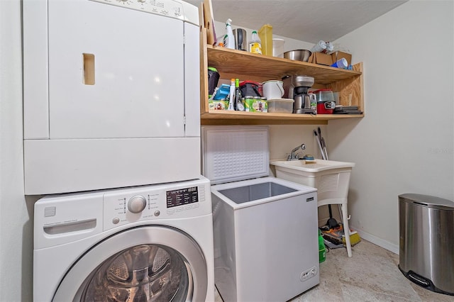 laundry room featuring stacked washing maching and dryer