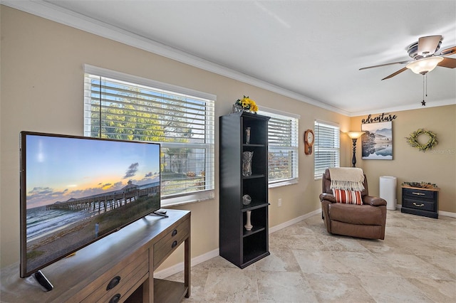 sitting room with plenty of natural light, ceiling fan, and crown molding