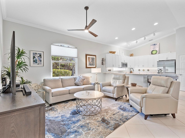 tiled living room featuring vaulted ceiling, ceiling fan, and ornamental molding