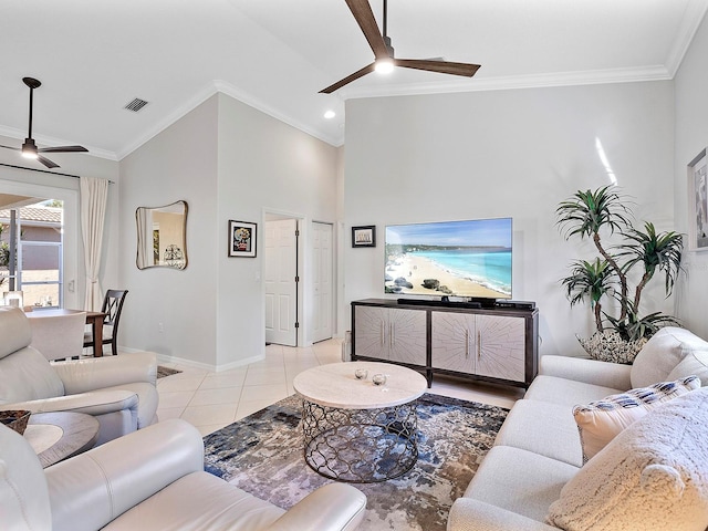 living room featuring ceiling fan, ornamental molding, and light tile patterned floors